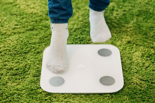 Smart Scales for Home. Girl Measures Weight During Diet.