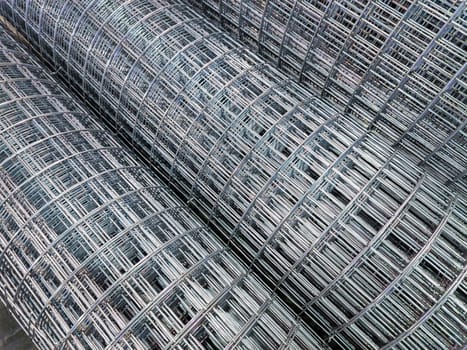 zync plated wired square mesh rolls close-up full frame background with selective focus