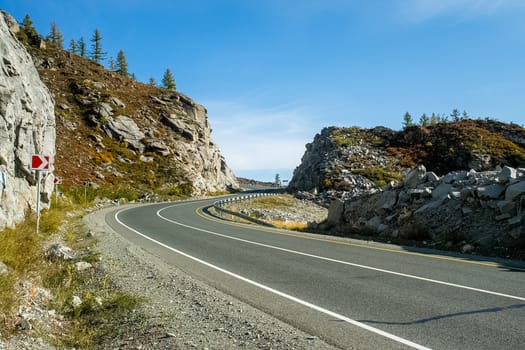 Asphalt road to the mountains. Mountain track on the Altai.