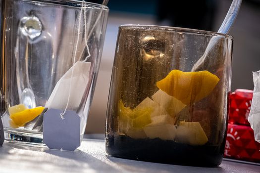 Transparent mug with tea. Brewing tea in a bag.