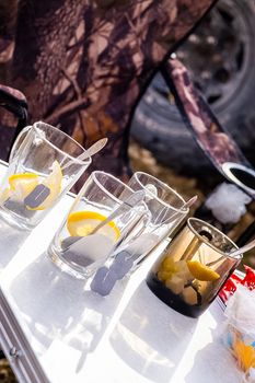 Transparent mug with tea. Brewing tea in a bag. Tea with lemon.