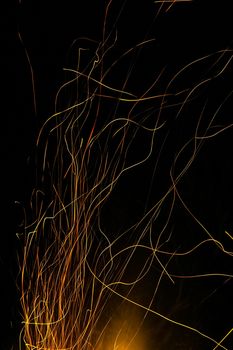 Sparks from a fire against a dark night. Bonfire