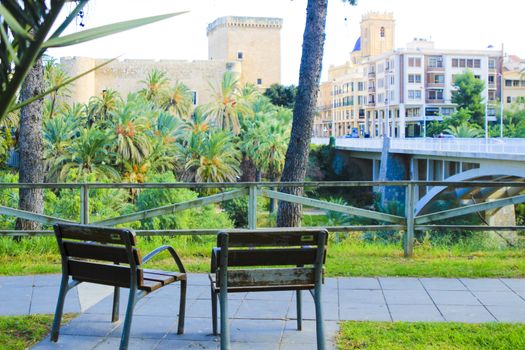 Elche, Alicante, Spain- November 16, 2020 - Landscape of the hillside of the Vinalopo River in Elche. Altamira Palace, Altamira bridge and Santa Maria church in the background