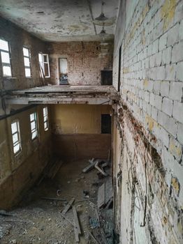 Urban exploration of ruins of old building with floor without floor