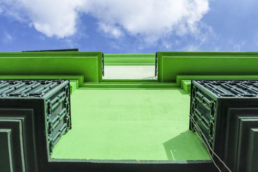 Beautiful green facade of Lisbon and blue sky in the background
