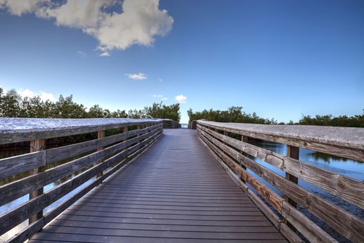 Boardwalk leading to Lovers Key State Park on a sunny day in Fort Myers, Florida