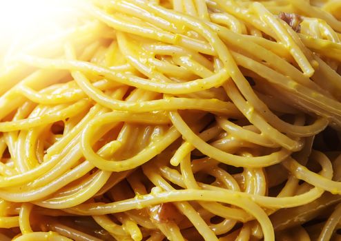 Close-up view of spaghetti with carbonara sauce. Typical Roman recipe with eggs, bacon, pecorino romano and parmesan. Typical Italian food and recipes