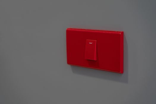 Electric button switch, electric control on-off on grey background.