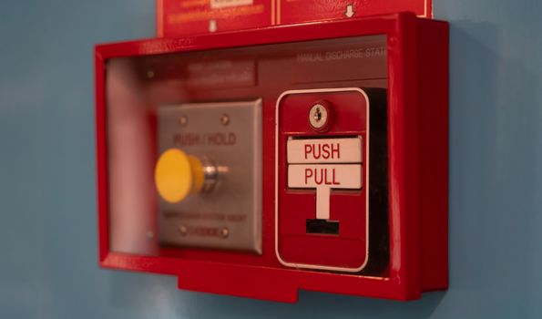 Fire alarm switch on wall. Emergency alarm button installed in a building.