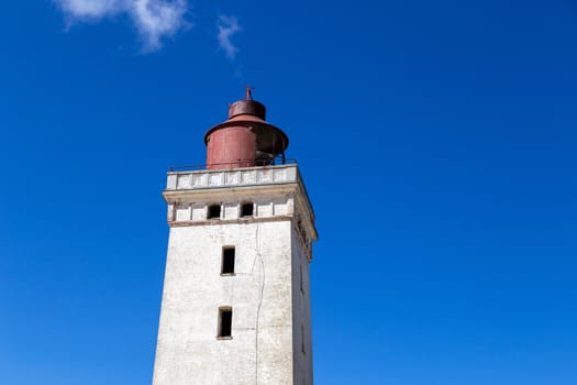 Lokken, Denmark - July 16, 2019: Close-up of Rubjerg Knude Lighthouse in Jutland.