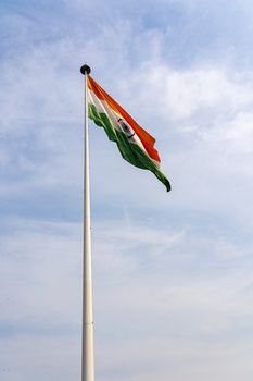 New Delhi, India - December 4, 2019: Big flagpole with the Indian Flag in Central Park.