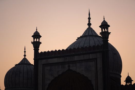 Delhi, India - December 04, 2019: Silhouette of historic Jama Masjid during sunset.