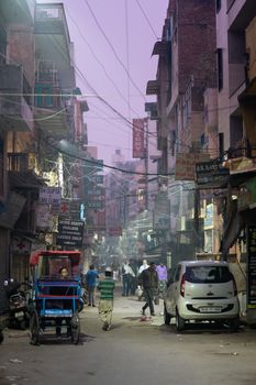 Delhi, India - December 05, 2019: Street at Main Bazaar in Paharganj district at early morning.