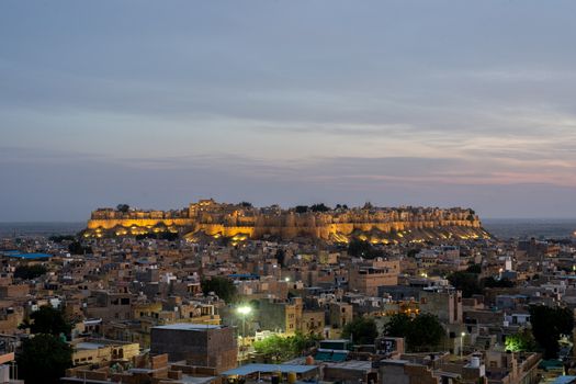 Jaisalmer, India - December 5, 2019: The illuminated Jaisalmer Fort during sunset.