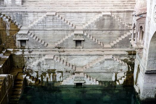 Jodhpur, India - December 8, 2019: The historic stepwell Toorji Ka Jhalra in the historic city centre.