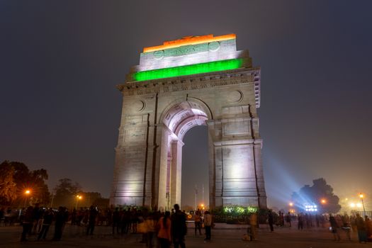 New Delhi, India - December 13, 2019: People in front of the illuminated India Gate at night.