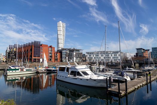 Malmo, Sweden - April 20, 2019: Small sailboat harbour with skyscraper Turning Torso in the background