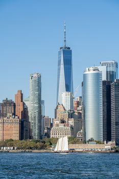 New York, United States of America - September 19, 2019: Sailboat in front of the Lower Manhattan skyline.