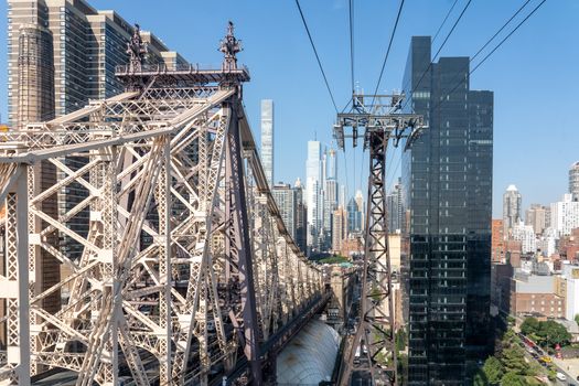 NYC, USA - September 23, 2019: The Queensboro Bridge and the tramway from Midtown Manhattan to Roosevelt Island.