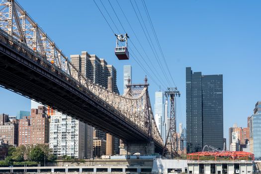 NYC, USA - September 23, 2019: The Queensboro Bridge and the tramway from Midtown Manhattan to Roosevelt Island.