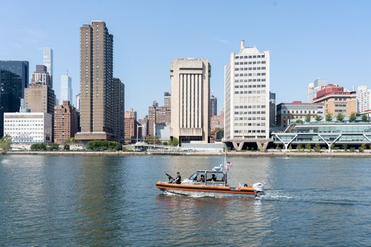 New York, United States of America - September 23, 2019: A U.S. Coast Guard boat patrolling on the East River