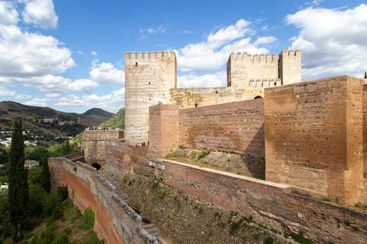 Granada, Spain - May 26, 2019: Exterior view of towers and walls at the famous Alhambra Palace