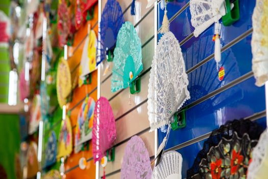 Granada, Spain - May 27, 2019: Colorful traditional Spanish fans for sale in a shop.