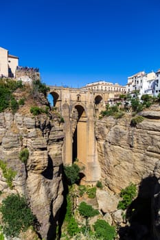 Ronda, Spain - May 31, 2019: View of the famous bridge Puente Nuevo in the historic city centre.