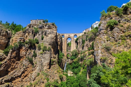 Ronda, Spain - May 31, 2019: View of the famous bridge Puente Nuevo in the historic city centre.