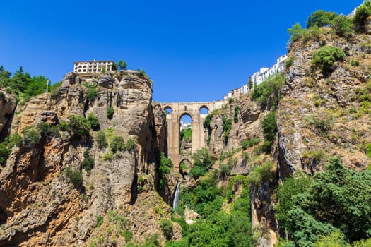 Ronda, Spain - May 31, 2019: View of the famous bridge Puente Nuevo in the historic city centre.