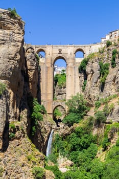 Ronda, Spain - May 31, 2019: View of the famous bridge Puente Nuevo in the historic city centre.