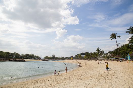 Singapore, Singapore - February 1, 2015: People at Siloso Beach on Sentosa Island.