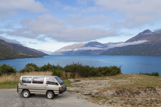 Wye Creek, New Zealand - March 27, 2015: Campervan in front of Lake Wakatipu on the South Island.