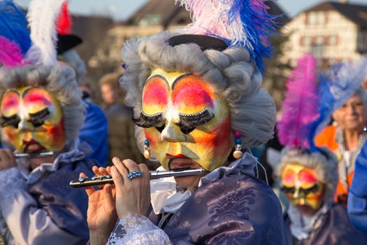 Basel, Switzerland - March 10, 2014: The tradtional carnival parade with dressed up people