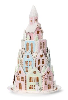 Fairy princess winter castle made of  gingerbread cookies with decorative Christmas sugar icing, isolated on white background