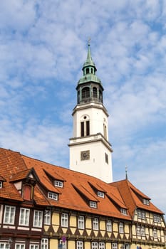 Celle, Germany - April 19, 2014: The church tower and half-timbered houses in the city center