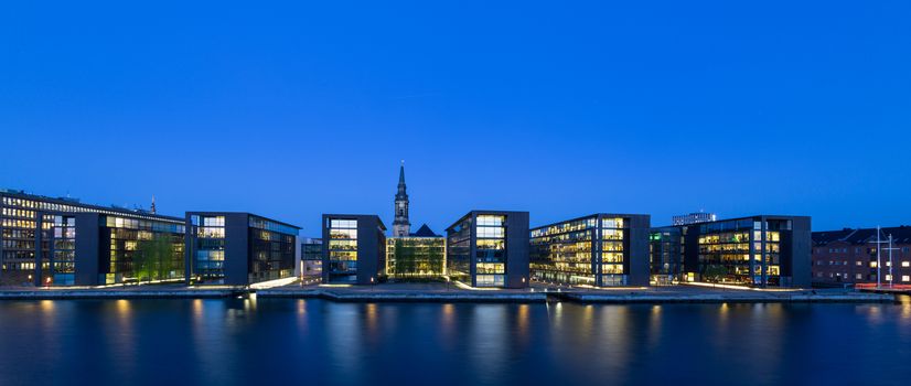 Copenhagen, Denmark - May 11, 2016:  Panoramic view of the harbour with Nordea Bank and Christian Church at night.