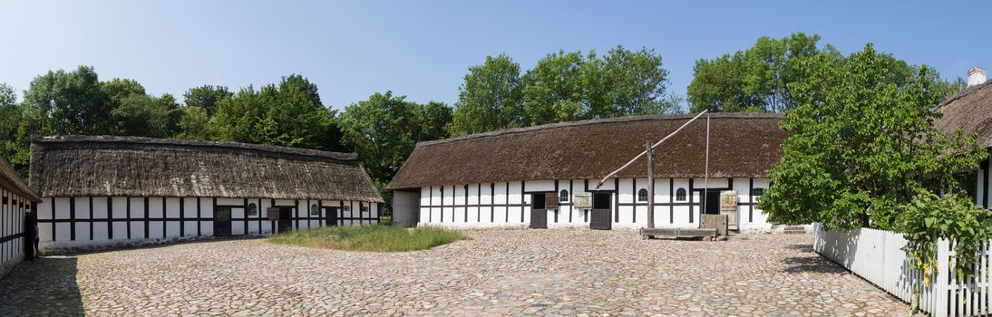Lyngby, Denmark - June 23, 2016: Panoramic view of courtyard of an ancient danish farmhouse.