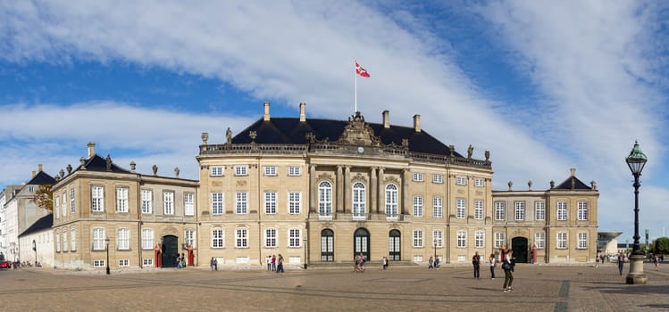 Copenhagen, Denmark - August 17, 2016: Tourists in front of the royal palace Amalienborg