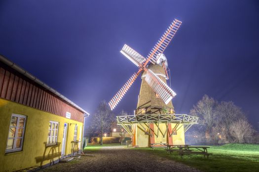 Ramloese, Denmark - December 30, 2016: HDR photo of an illuminated historic Danish windmill