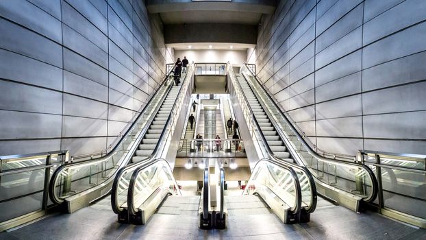 Copenhagen, Denmark - January 20, 2017: People on escalators at Forum metro station