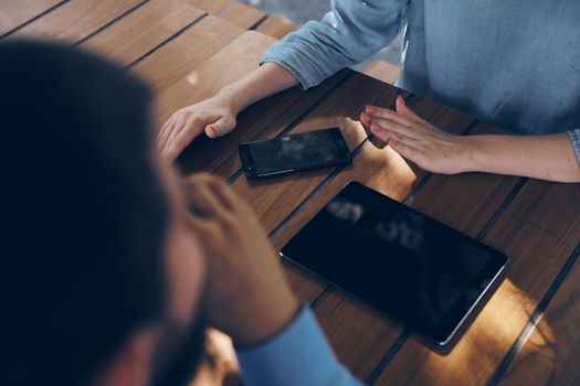 Man and woman are sitting at the table telephone technology internet officials. High quality photo