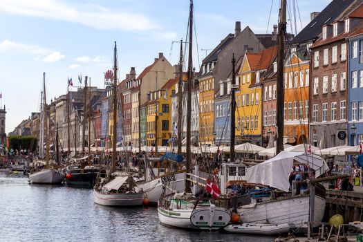 Copenhagen, Denmark - September 02, 2017: Famous Nyhavn harbor with boats in the historical city centre