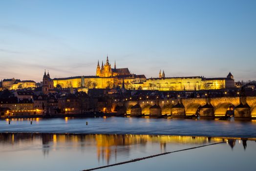 Prague, Czech Republic - March 15, 2017: Evening sunset view of Prague Castle and Charles Bridge.