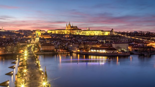 Prague, Czech Republic - March 16, 2017: Evening view of Prague Castle and Charles Bridge from the Old Town Bridge Tower