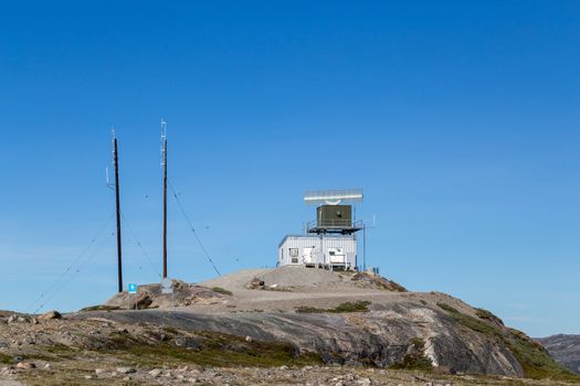 Kangerlussuaq, Greenland - July 13, 2018: Radar Tower Station close to the aiport. Kangerlussuaq is a settlement in western Greenland and Greenland's main air transport hub.