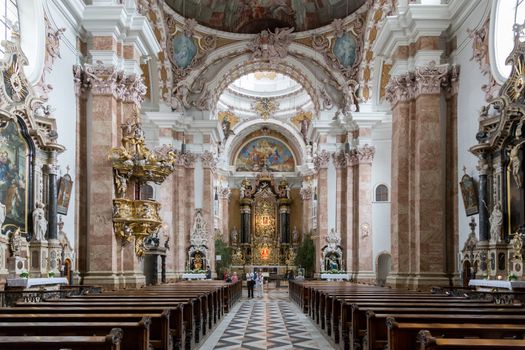 Innsbruck, Austria - June 8, 2018: Interior view of Innsbruck Cathedral with people