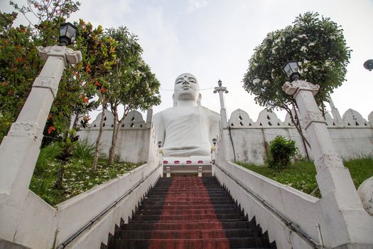 Kandy, Sri Lanka - August 10, 2018: Bahirawakanda Vihara Buddha Statue ocated on top of a hill