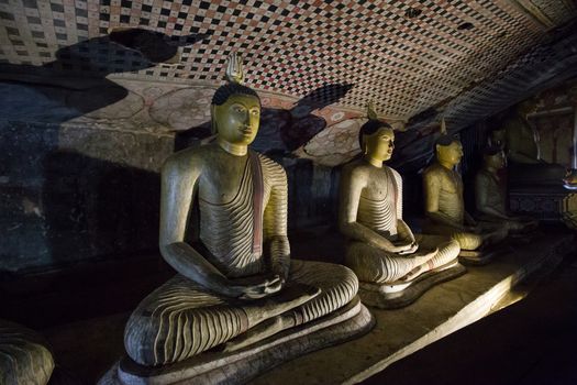 Dambulla, Sri Lanka - August 15, 2018: Buddha statues inside the historical Dambulla Cave Temple