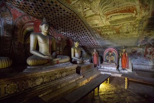 Dambulla, Sri Lanka - August 15, 2018: Buddha statues inside the historical Dambulla Cave Temple